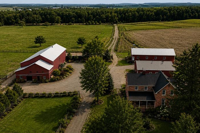 farm property with a house, barn, workshop and storage shed in Southwestern Ontario
