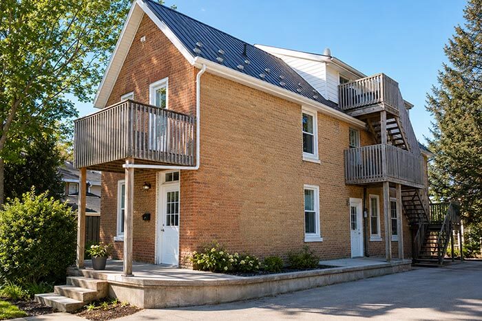 Purpose-built townhouse multiplex with attached garages and private driveways