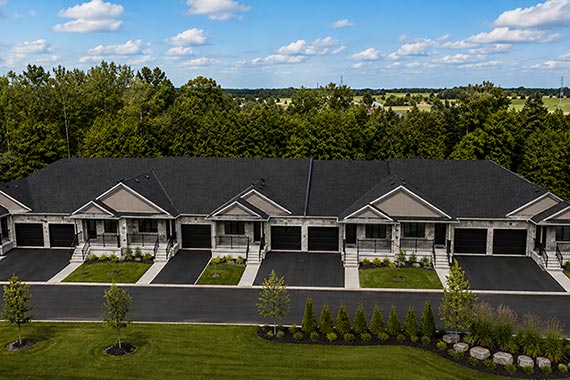 Purpose-built townhouse multiplex with attached garages and private driveways